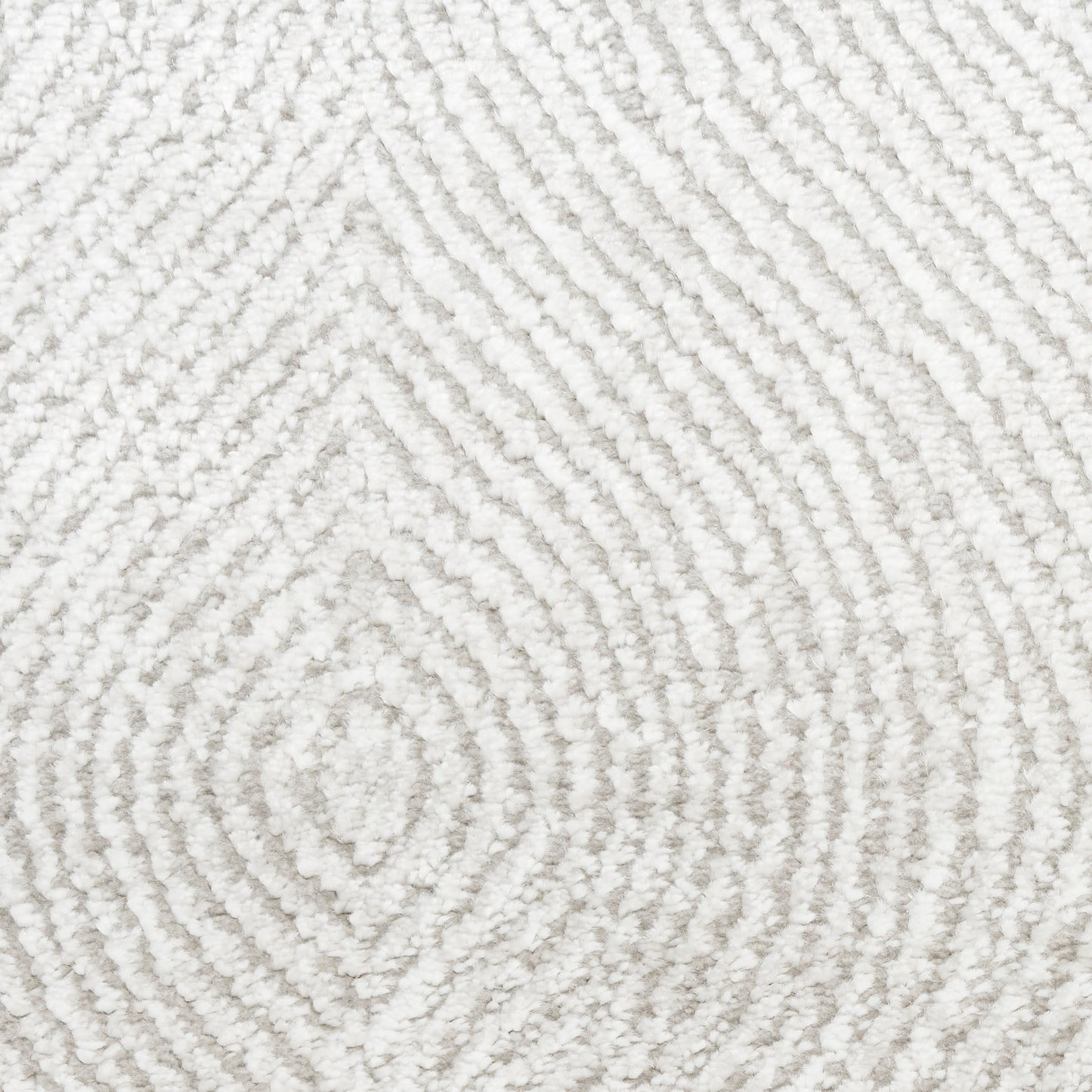 Cream textured area rug with raised concentric diamond pattern in plush loop pile.