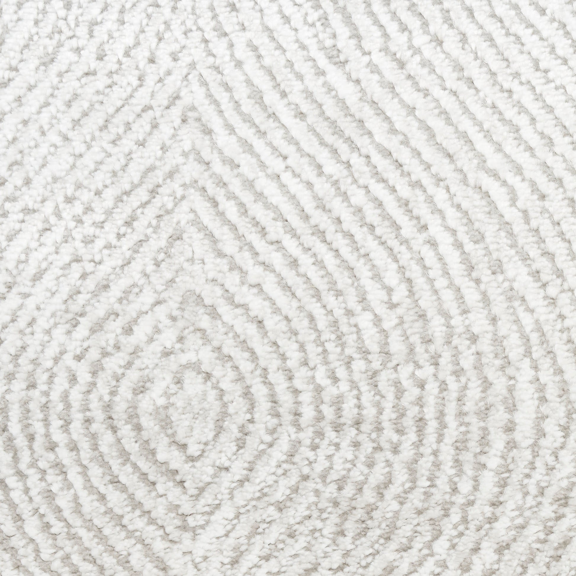 Cream textured area rug with raised concentric diamond pattern in plush loop pile.