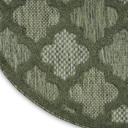 Matte olive-gray square overlay on a dark green textured fabric, modern geometric textile look.