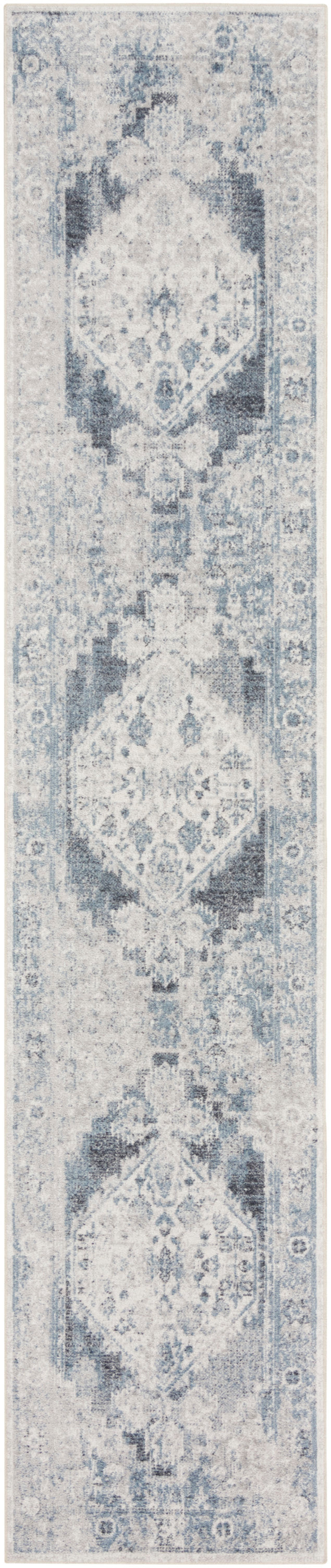Rectangular hallway rug runner in distressed light blue and ivory with repeating geometric medallion motif.