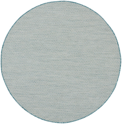 Round beige rug with teal border and a fine woven lattice pattern.