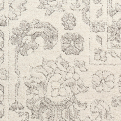 Cream rug with light gray floral and medallion motifs in a Persian-style pattern.