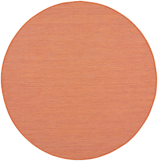 Round orange woven placemat with fine grid texture and edge binding.