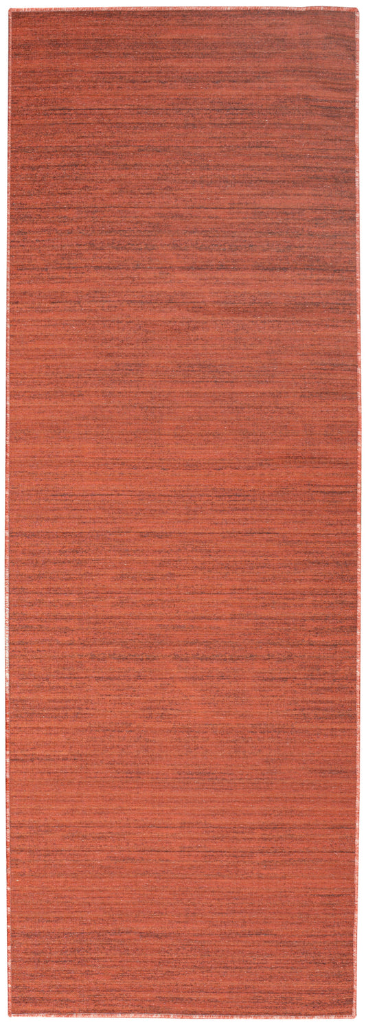 Terracotta orange flat-weave rug runner with subtle horizontal striations; long hallway size.