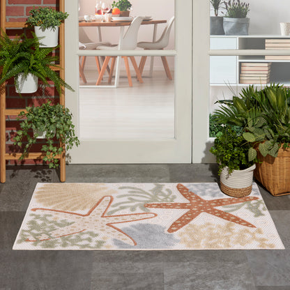 Outdoor rug with beach-themed orange and beige starfish designs on a light gray background at a doorway flanked by potted plants.