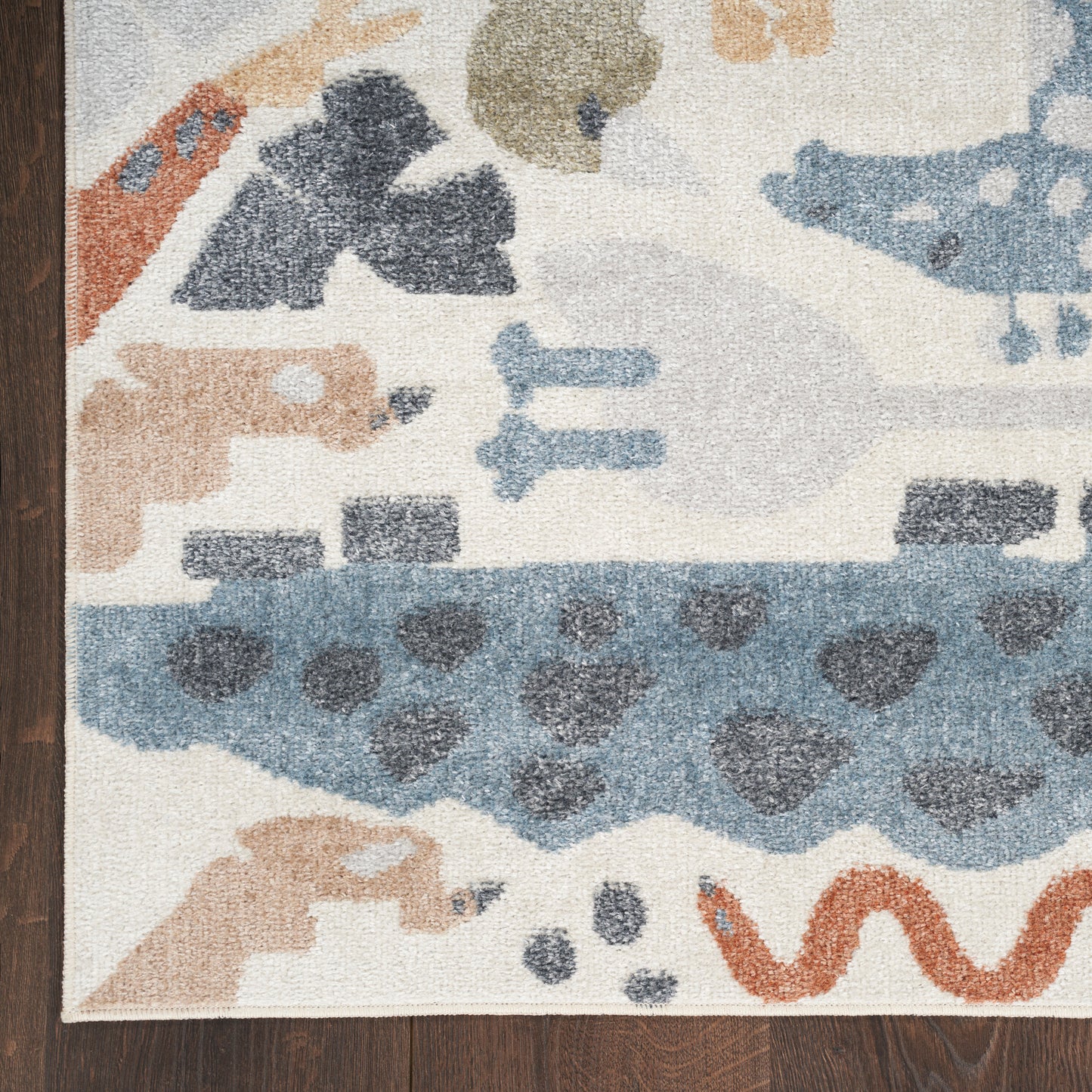Cream abstract runner rug with pastel blue, tan, gray and orange shapes; plush pile, modern boho-inspired design.