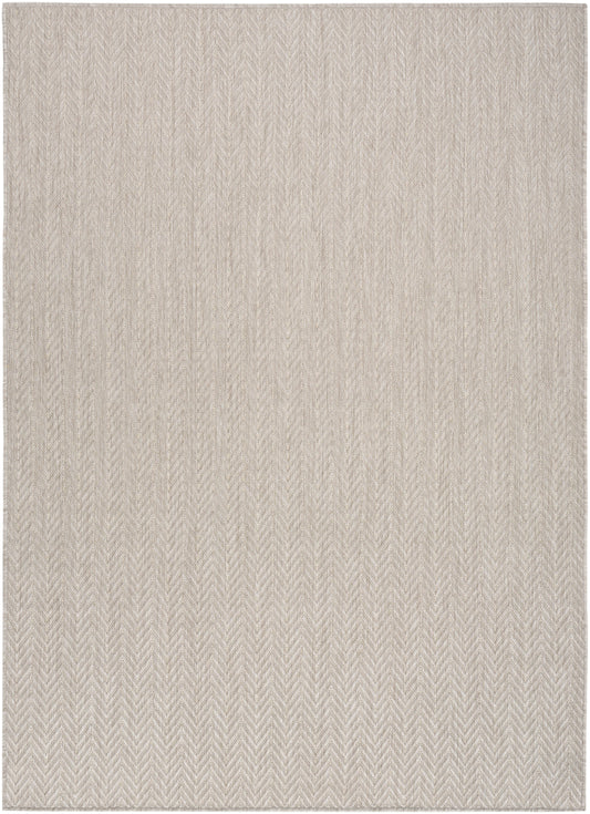 Beige woven rug with subtle herringbone texture; rectangular 6' x 9' neutral decor rug.
