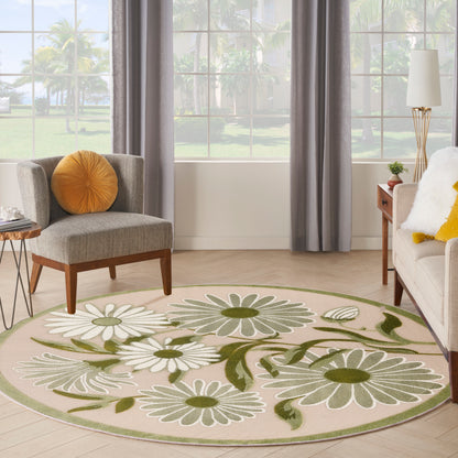 Round floral area rug with white daisies and green leaves on beige field, pale green border.