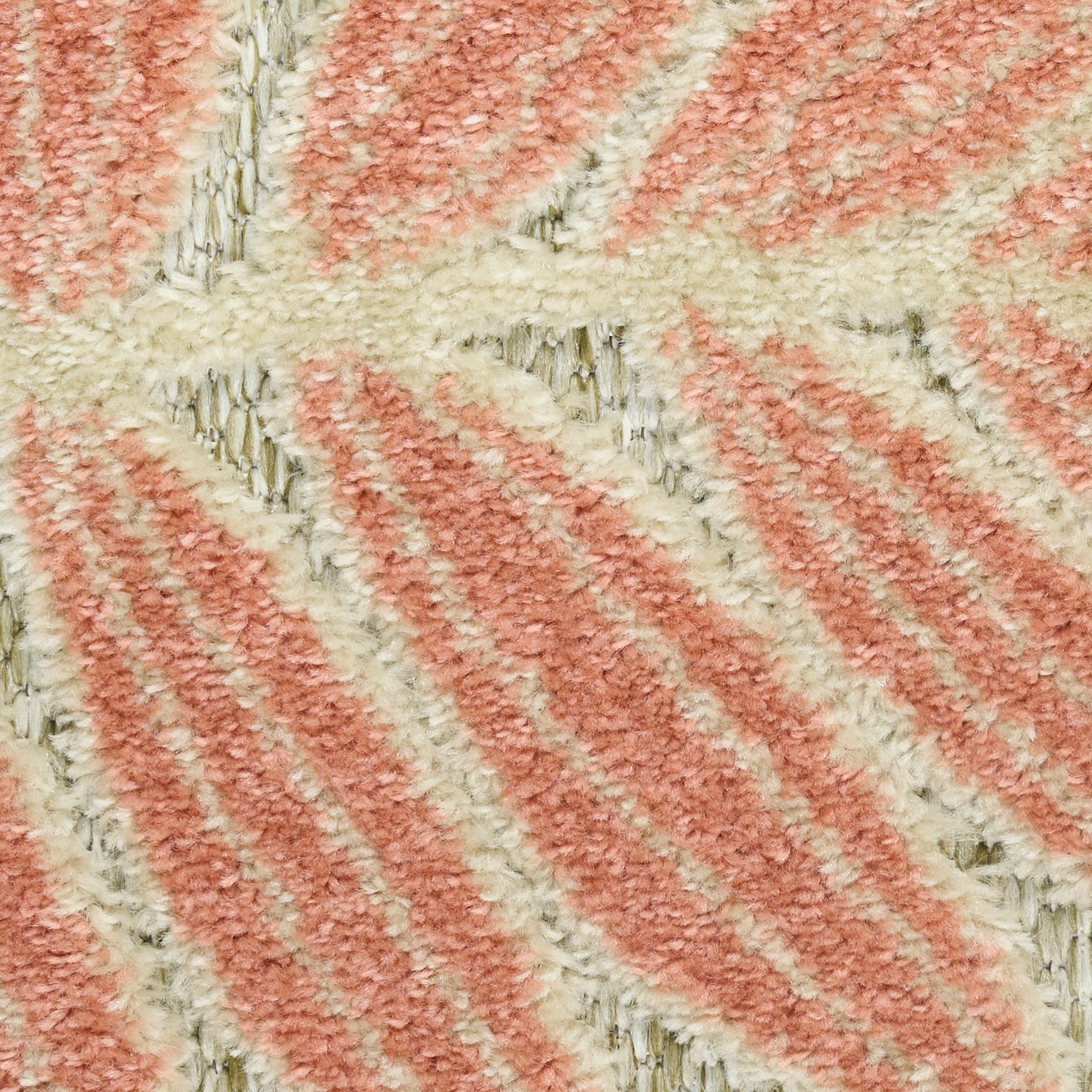 Soft peach and ivory striped tufted rug with plush pile and diagonal geometric pattern.