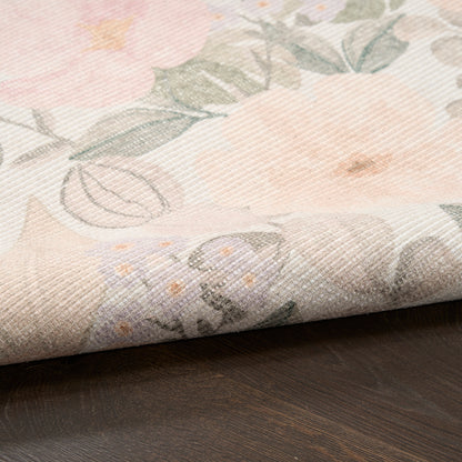 Pastel floral woven fabric with soft pink, peach and lavender blooms, green leaves; versatile decor textile.