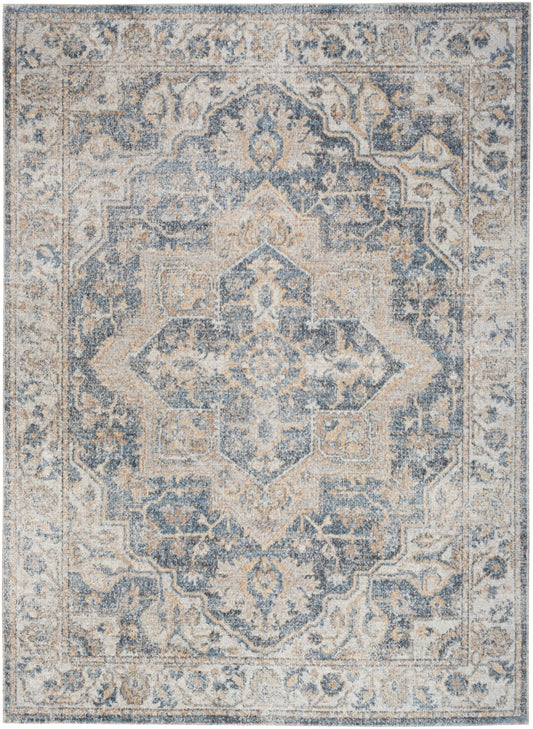 Blue and cream distressed Oriental area rug with a central medallion and floral border, vintage Persian-inspired design.