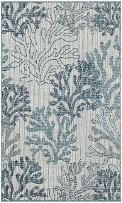 Teal and blue coral reef pattern rug with seaweed motifs on a light gray background.