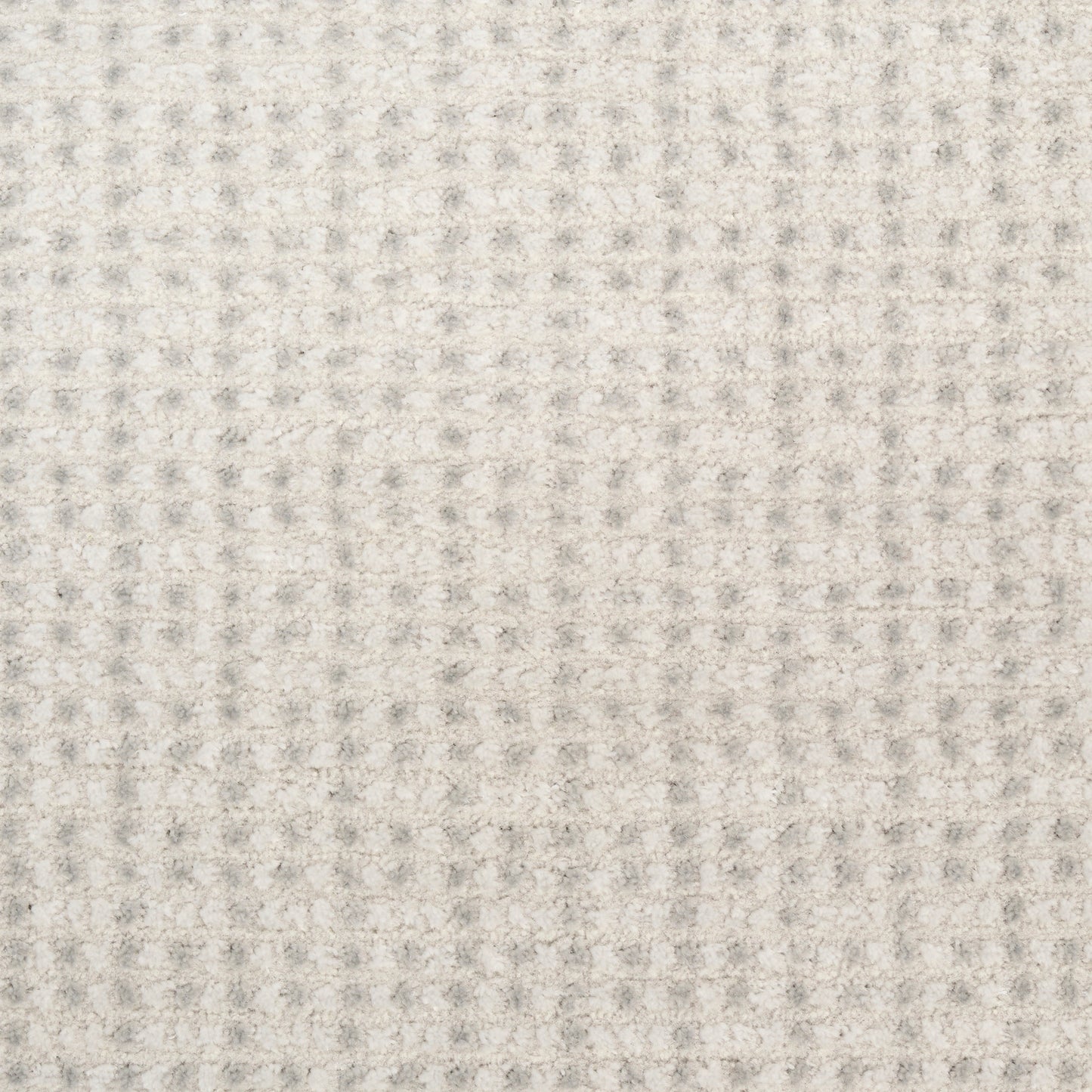 Beige waffle-textured fabric close-up with small raised squares; soft, neutral knit look.
