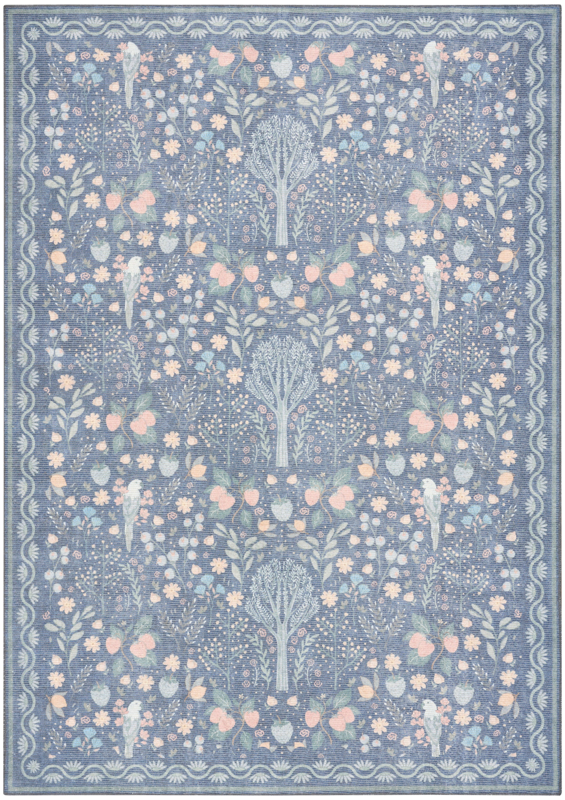 Blue floral area rug with pastel pink and pale yellow blossoms and a decorative border in a modern motif.