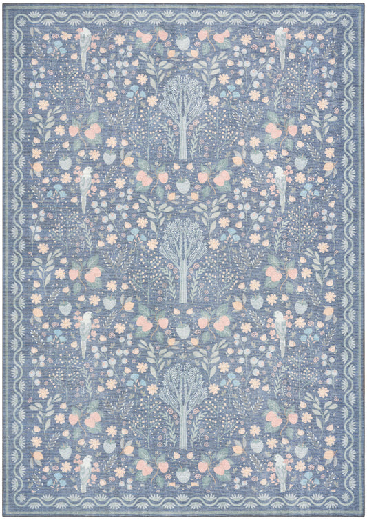 Blue floral area rug with pastel pink and pale yellow blossoms and a decorative border in a modern motif.
