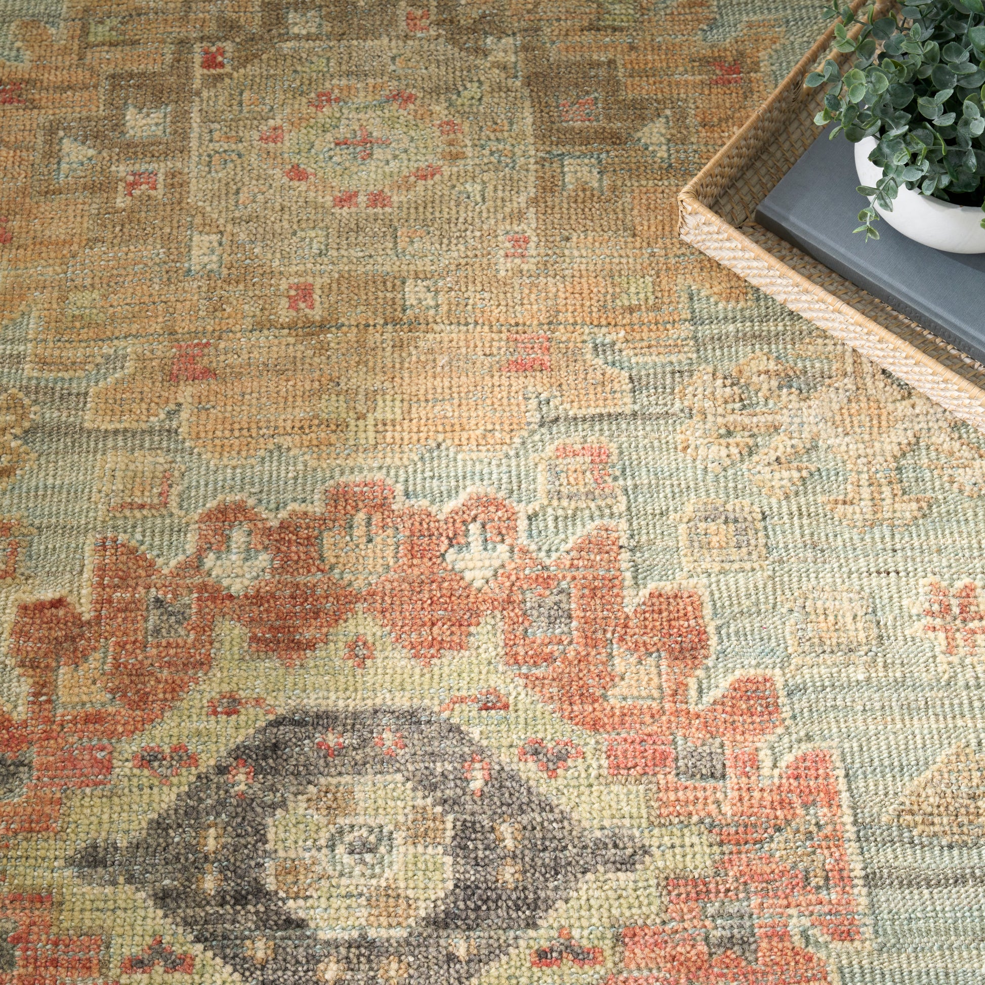 Colorful vintage kilim rug, 9' x 12', with geometric motif and diamond medallion in greens, reds, yellows; woven floor decor.
