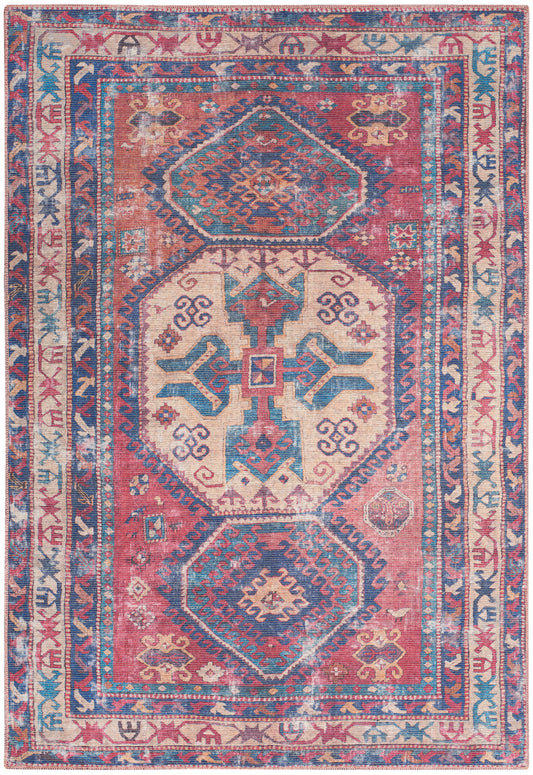 Colorful Persian-style area rug with pink, teal and blue hexagonal medallions, cream center, and decorative blue borders.