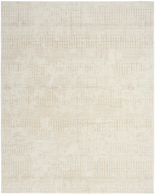 Neutral beige area rug with a muted, distressed patchwork pattern and soft, warm tones.