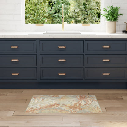 Navy blue shaker cabinets with copper handles, white countertop, gold faucet, tropical floral rug on wood floor.