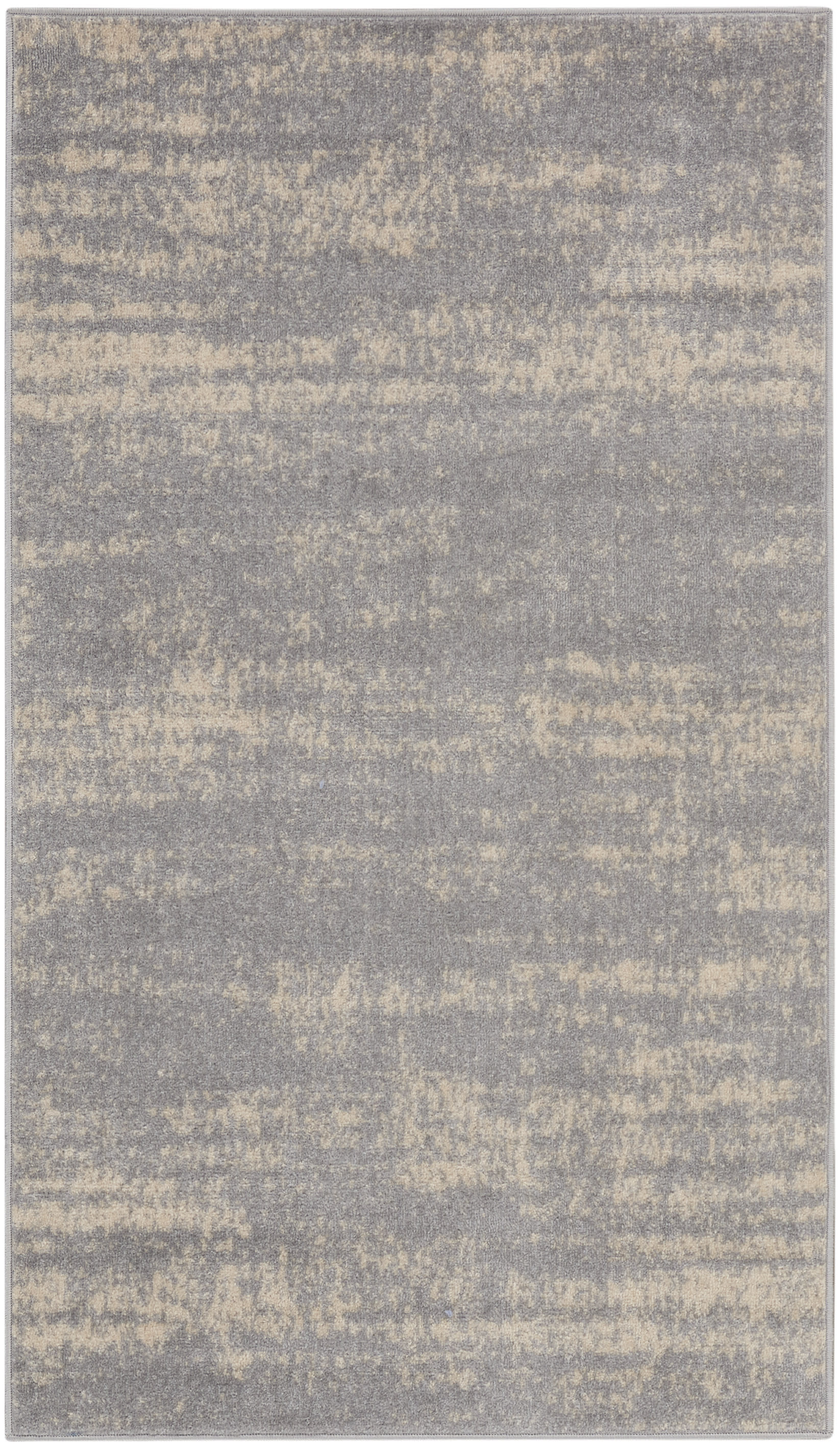 Rectangular area rug in gray with beige speckled abstract pattern; soft, plush texture and modern style.