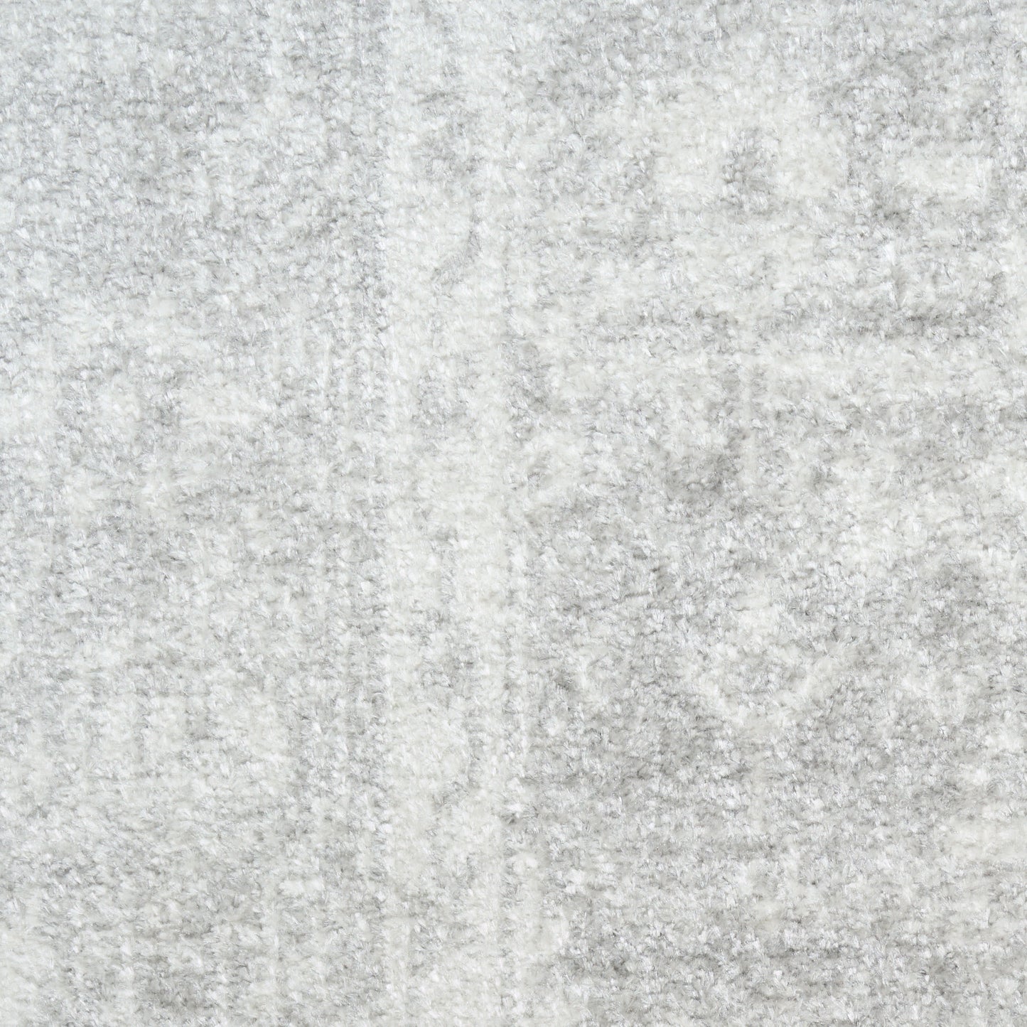 Light gray textured round rug with soft plush pile and marbled pattern, 5' diameter