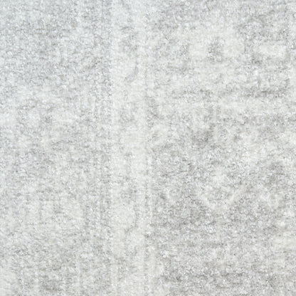 Light gray textured round rug with soft plush pile and marbled pattern, 5' diameter