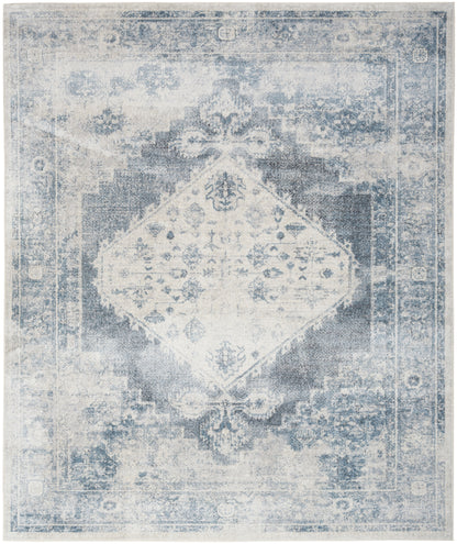 Blue distressed vintage oriental rug with central diamond medallion, faded wash, ivory & azure tones, rectangular decor rug.