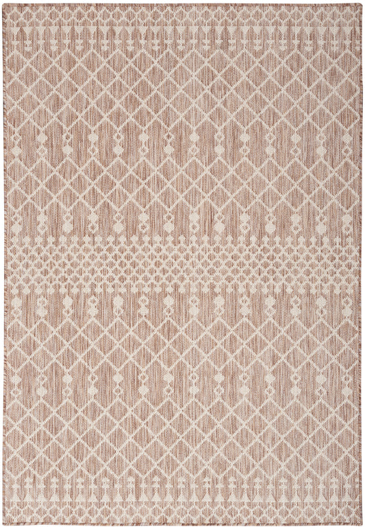 Soft pink-beige rug with white lattice diamonds and dotted bands, woven geometric design for living room decor.