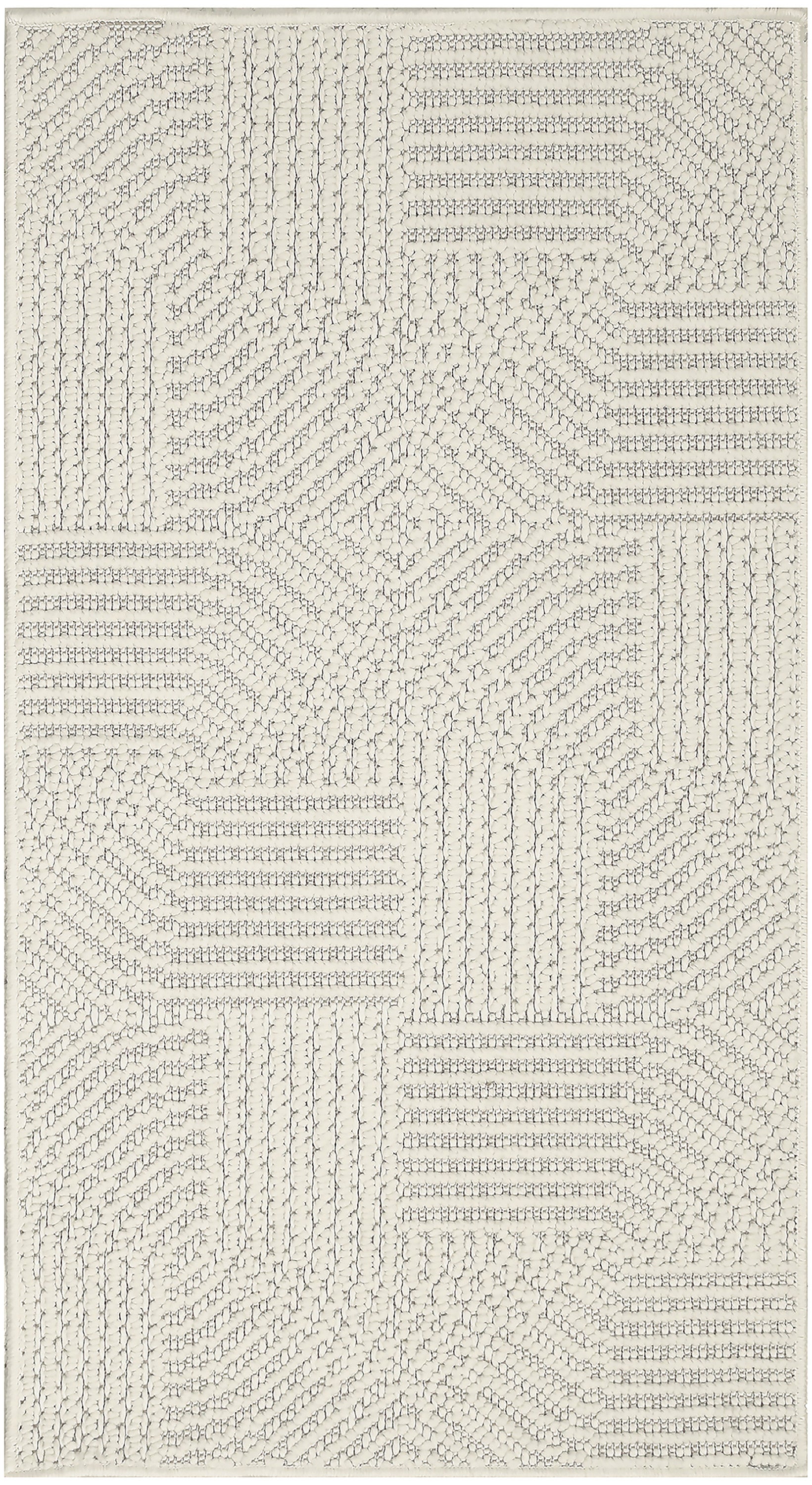Cream textured area rug with a raised loop geometric patchwork in rectangular blocks.