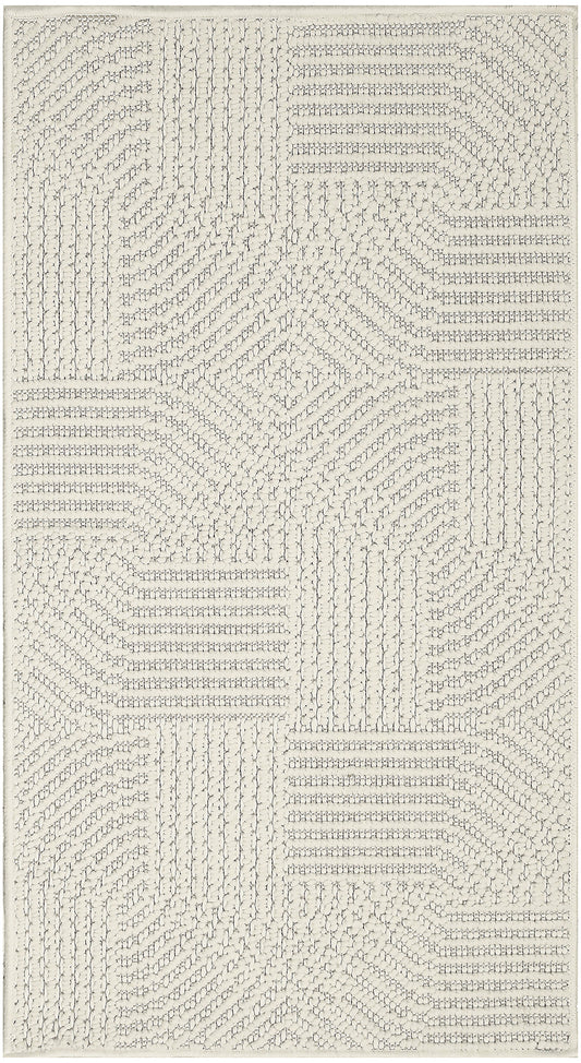 Cream textured area rug with a raised loop geometric patchwork in rectangular blocks.