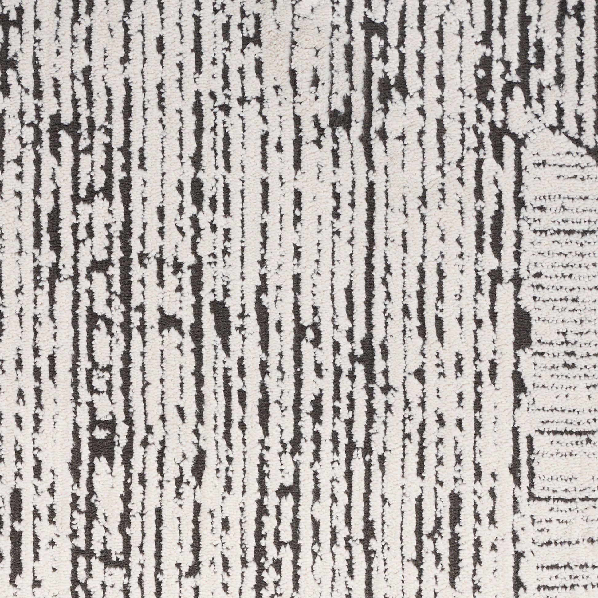 Ivory rug with charcoal vertical stripe pattern; textured woven look, modern abstract style for living room or hallway.