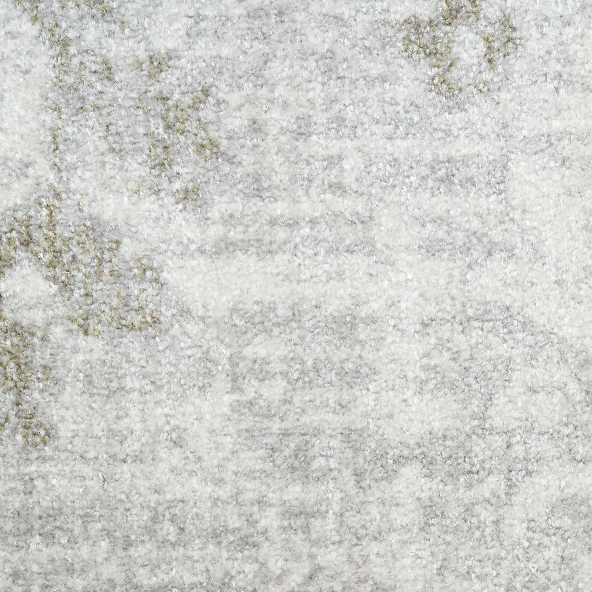 Light gray area rug with a subtle distressed beige-gold pattern and plush texture.