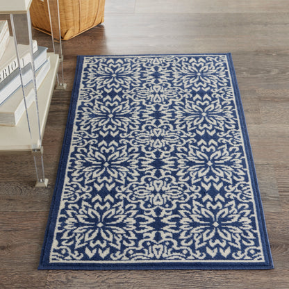 Rectangular navy and ivory damask-patterned area rug with floral motifs and a dark blue border on a wood floor (2' x 4').