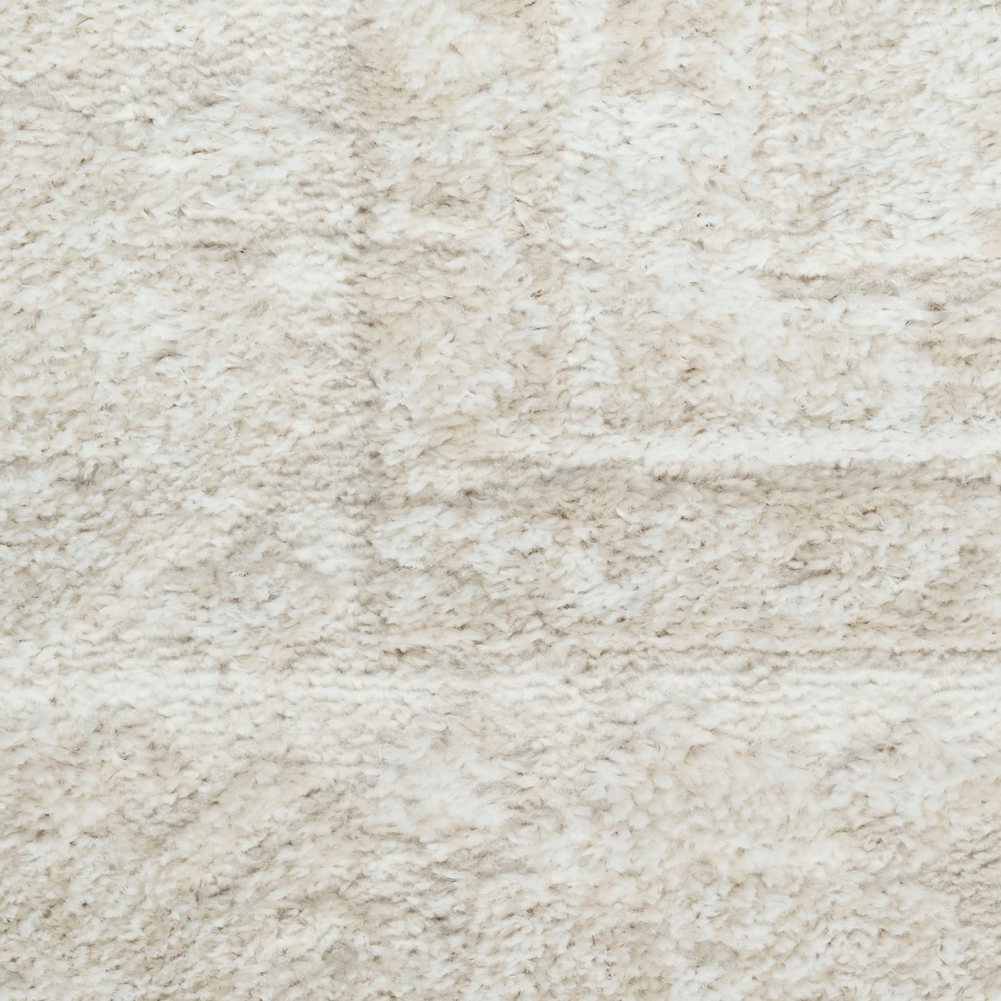 Beige plush shag rug close-up with soft, fluffy pile.