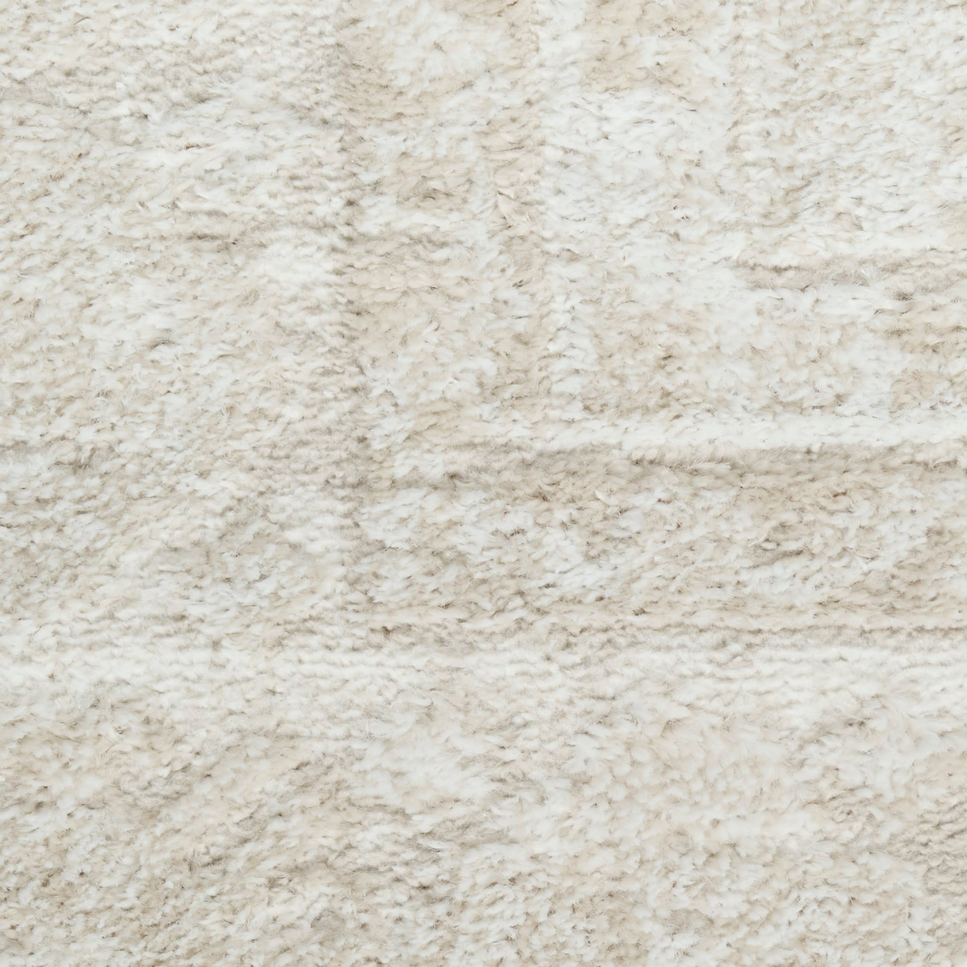 Beige plush shag rug close-up with soft, fluffy pile.