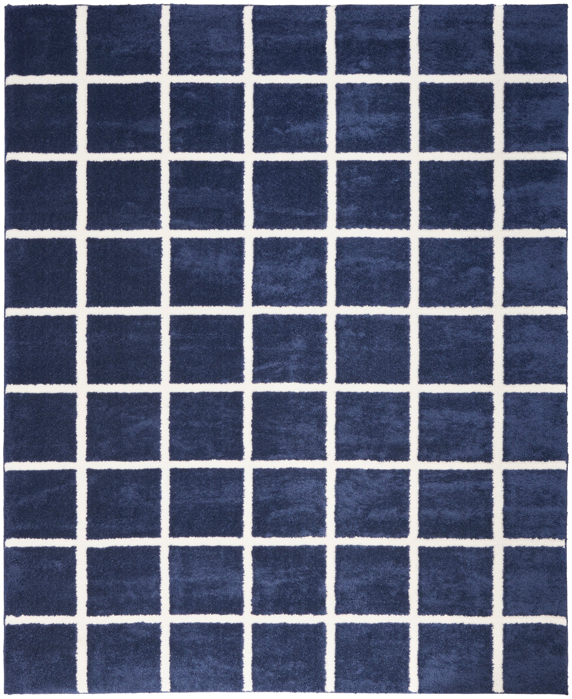 Navy blue rug with a white grid pattern of evenly spaced lines; square tiled look, modern geometric style.