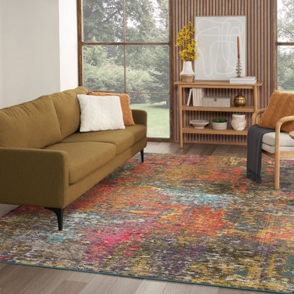 Olive-green mid-century sofa with white and orange pillows, colorful abstract rug, wooden shelves in bright living room.