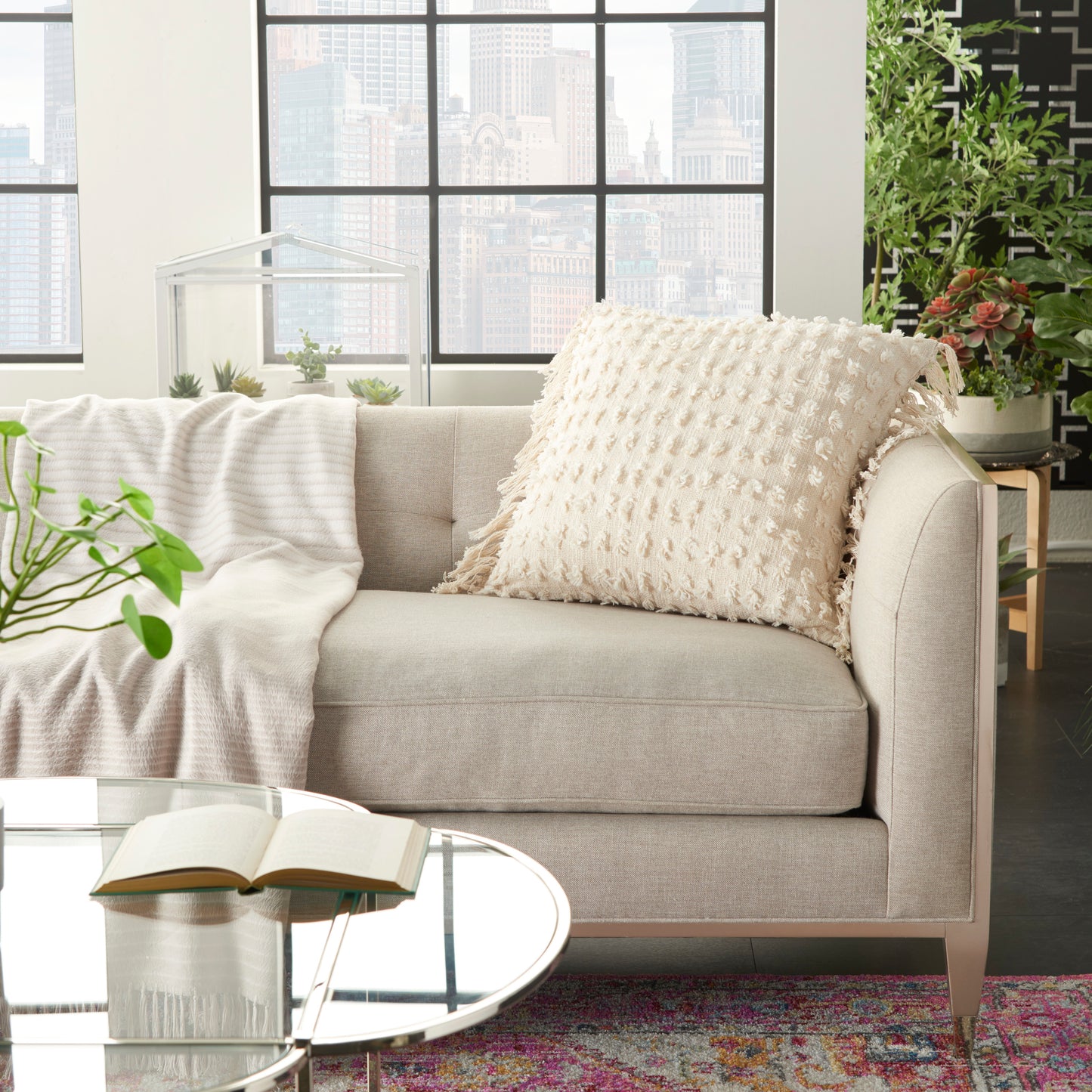Cream farmhouse decorative pillow, textured fabric, 20" x 20", on a beige sofa.