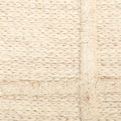 Cream chunky knit fabric with thick yarn featuring a subtle grid pattern; cozy wool throw blanket texture.