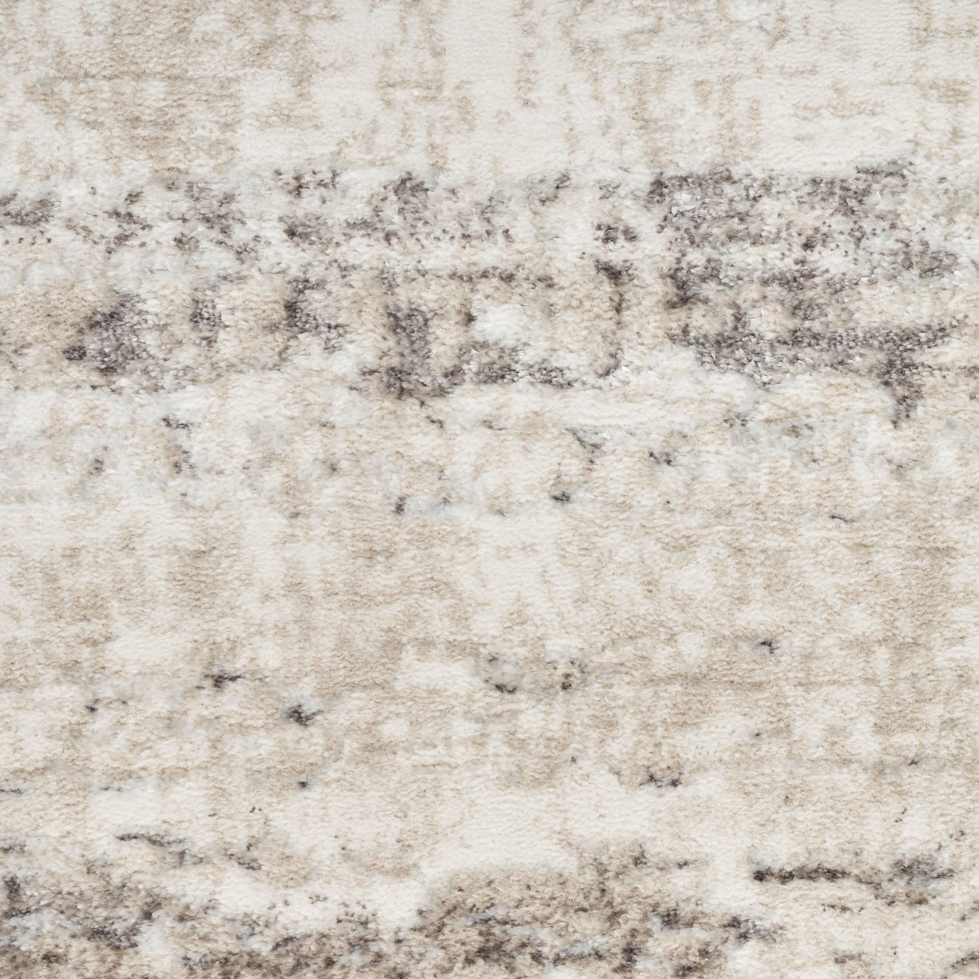 Neutral beige and cream area rug with distressed gray abstract pattern and soft plush texture.