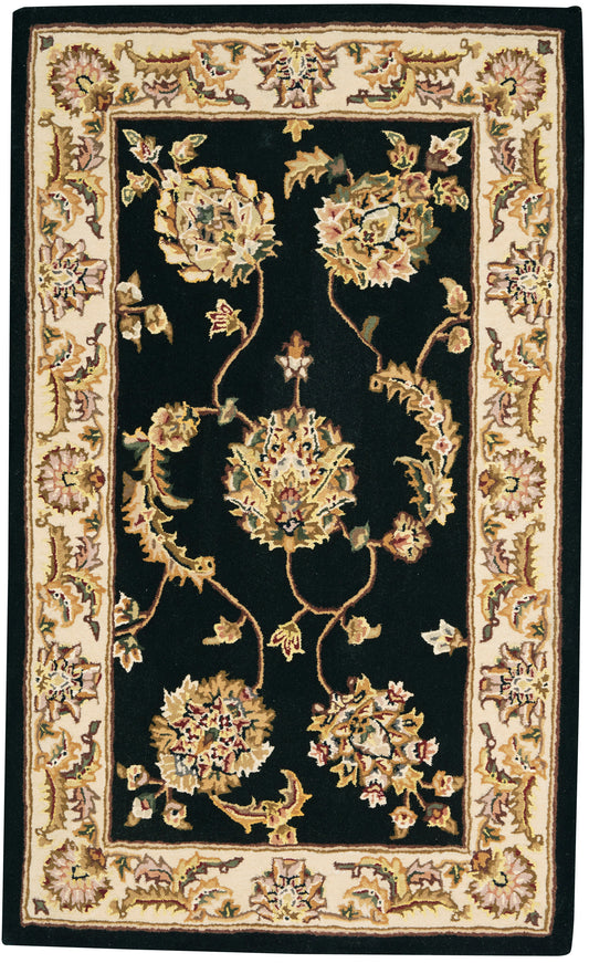 Rectangular Persian-style area rug with black field and ivory-gold floral border, ornate cream-and-gold vines.