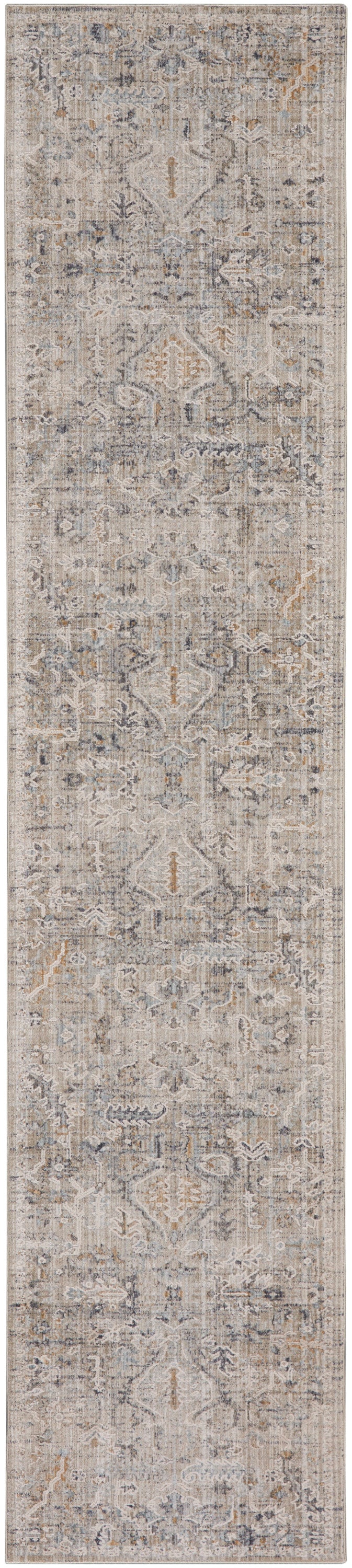 Long rectangular runner rug in muted beige-gray with distressed vintage/oriental pattern and blue accents