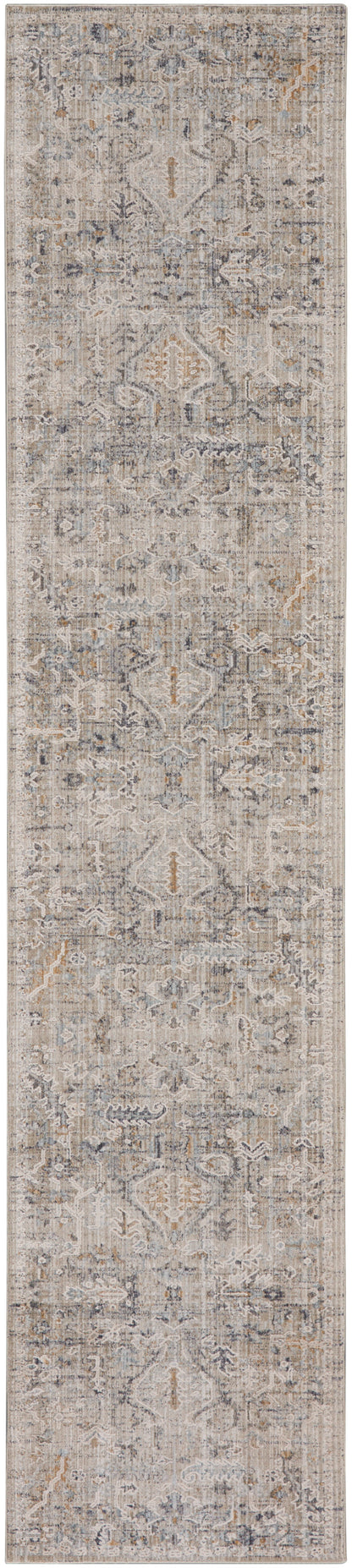 Long rectangular runner rug in muted beige-gray with distressed vintage/oriental pattern and blue accents