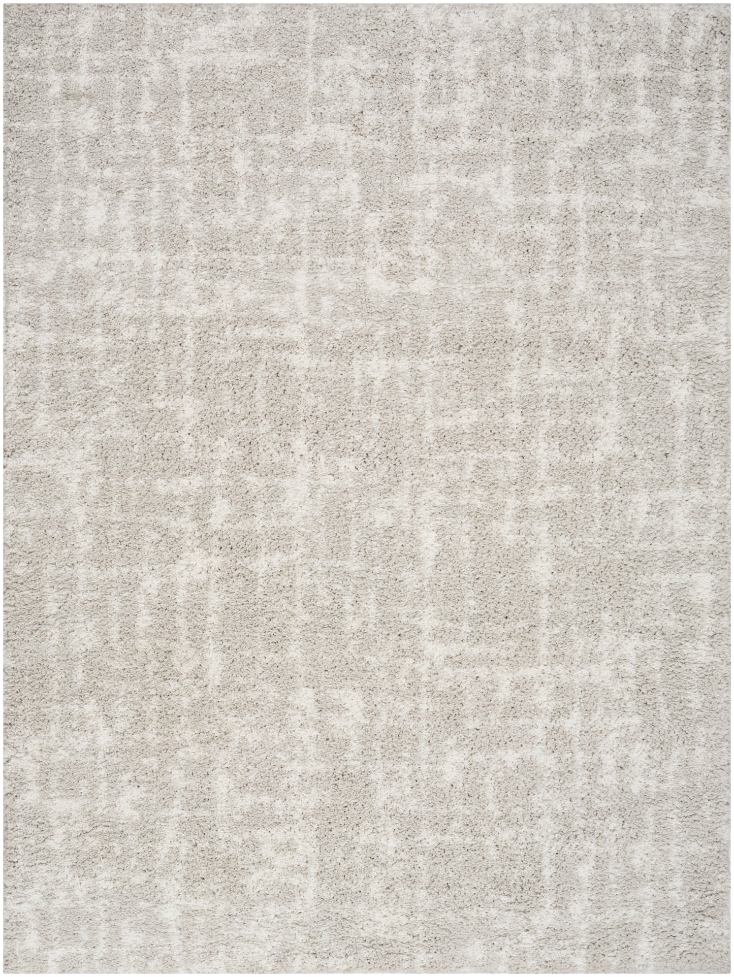 Neutral gray-beige textured area rug with a soft plush pile and subtle abstract pattern.