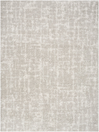 Neutral gray-beige textured area rug with a soft plush pile and subtle abstract pattern.