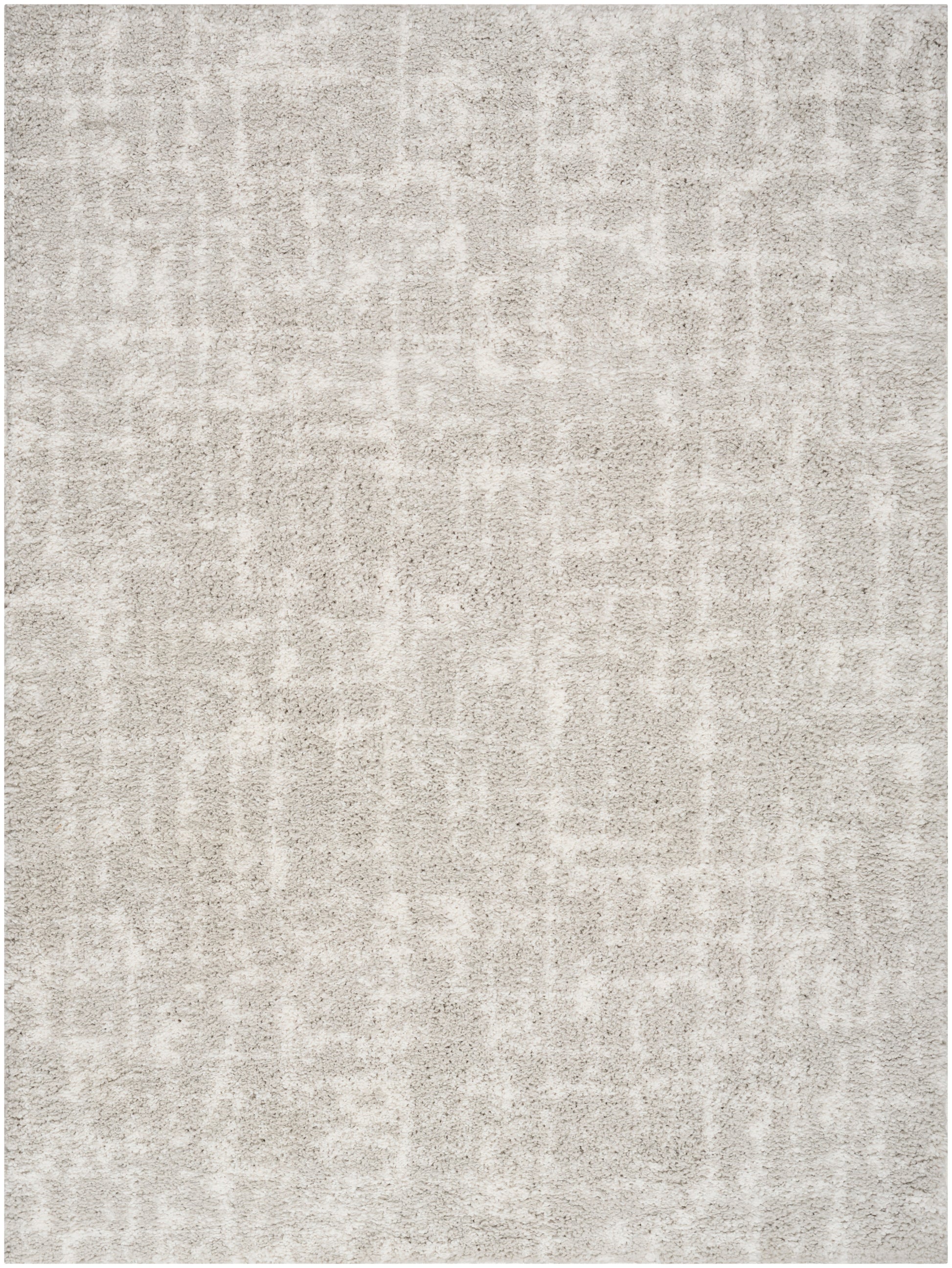 Neutral beige textured rug with a subtle mottled pattern and soft, low-pile look.