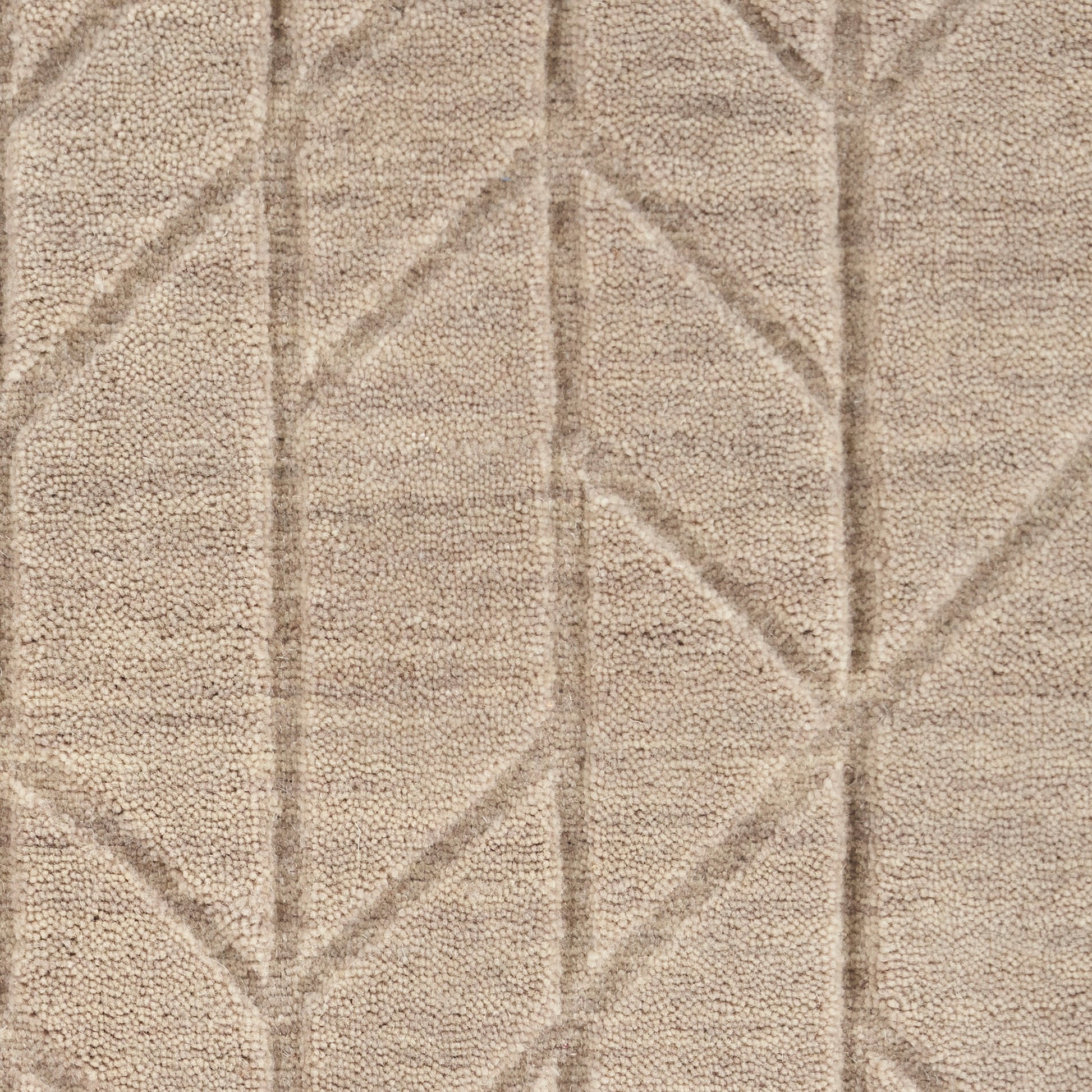 Beige tufted rug with a geometric diamond line pattern and soft plush pile.