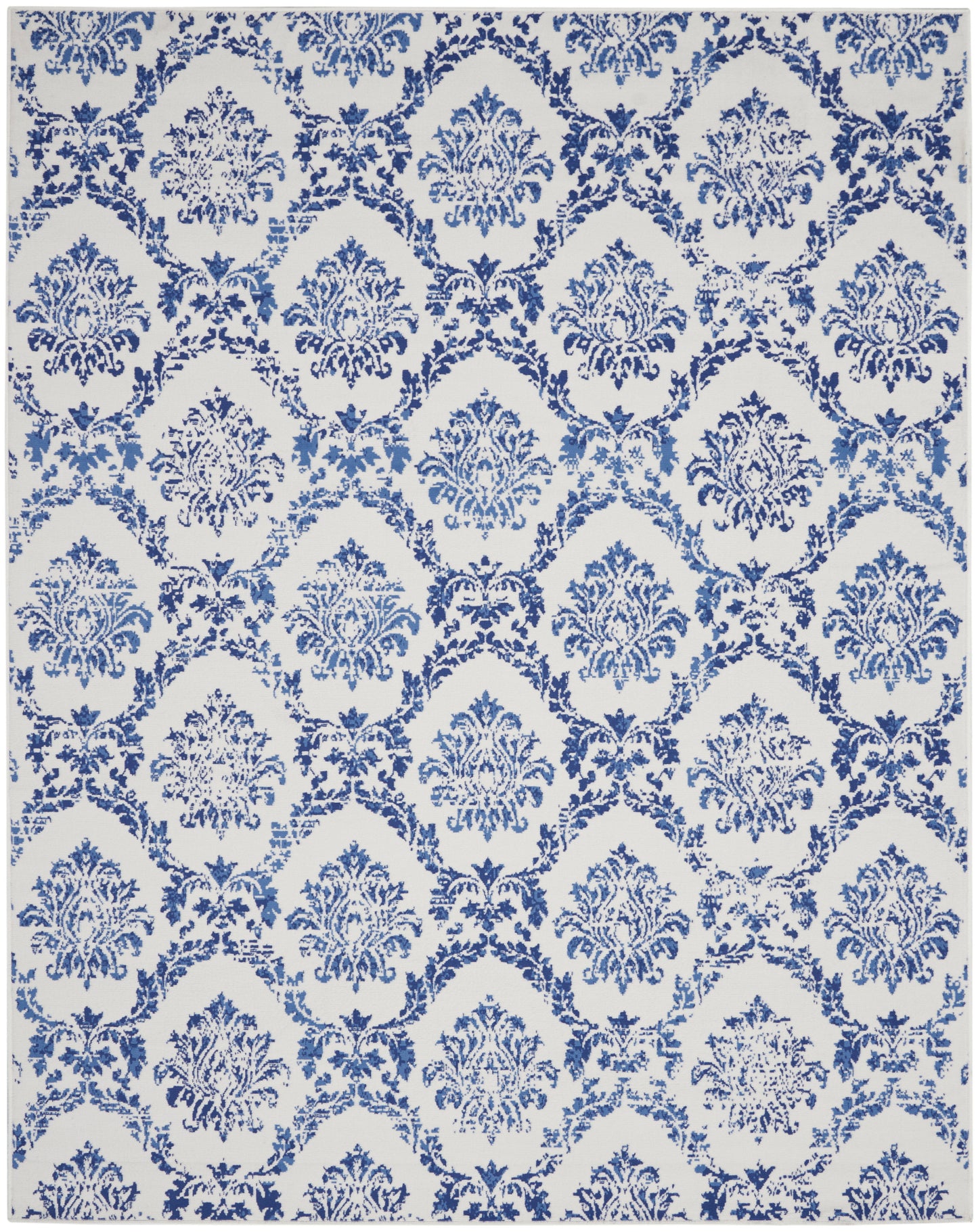 Blue damask motif rug on a white background with repeating ornate medallions and arches.