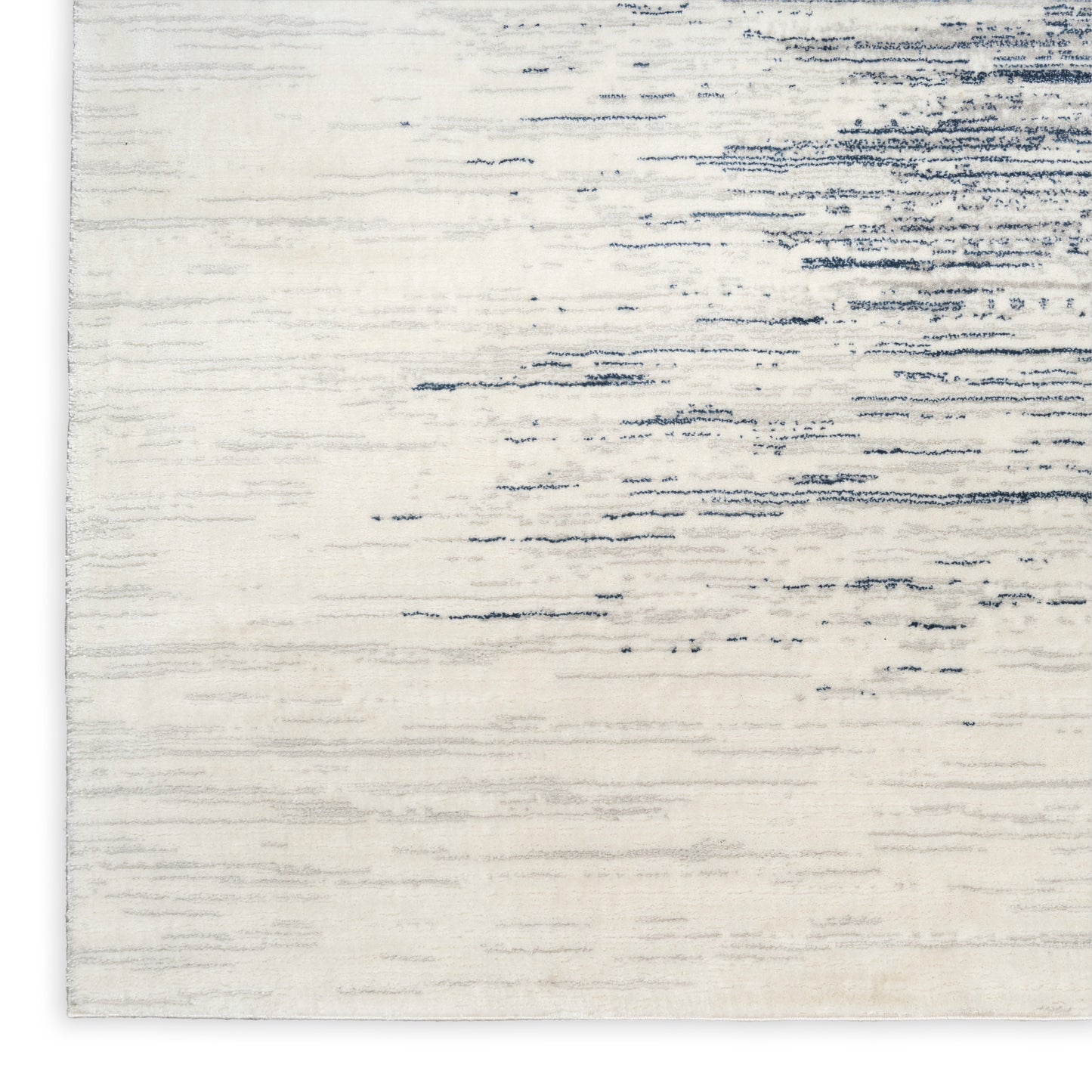 Creamwashed rug with blue-gray distressed pattern; modern style.
