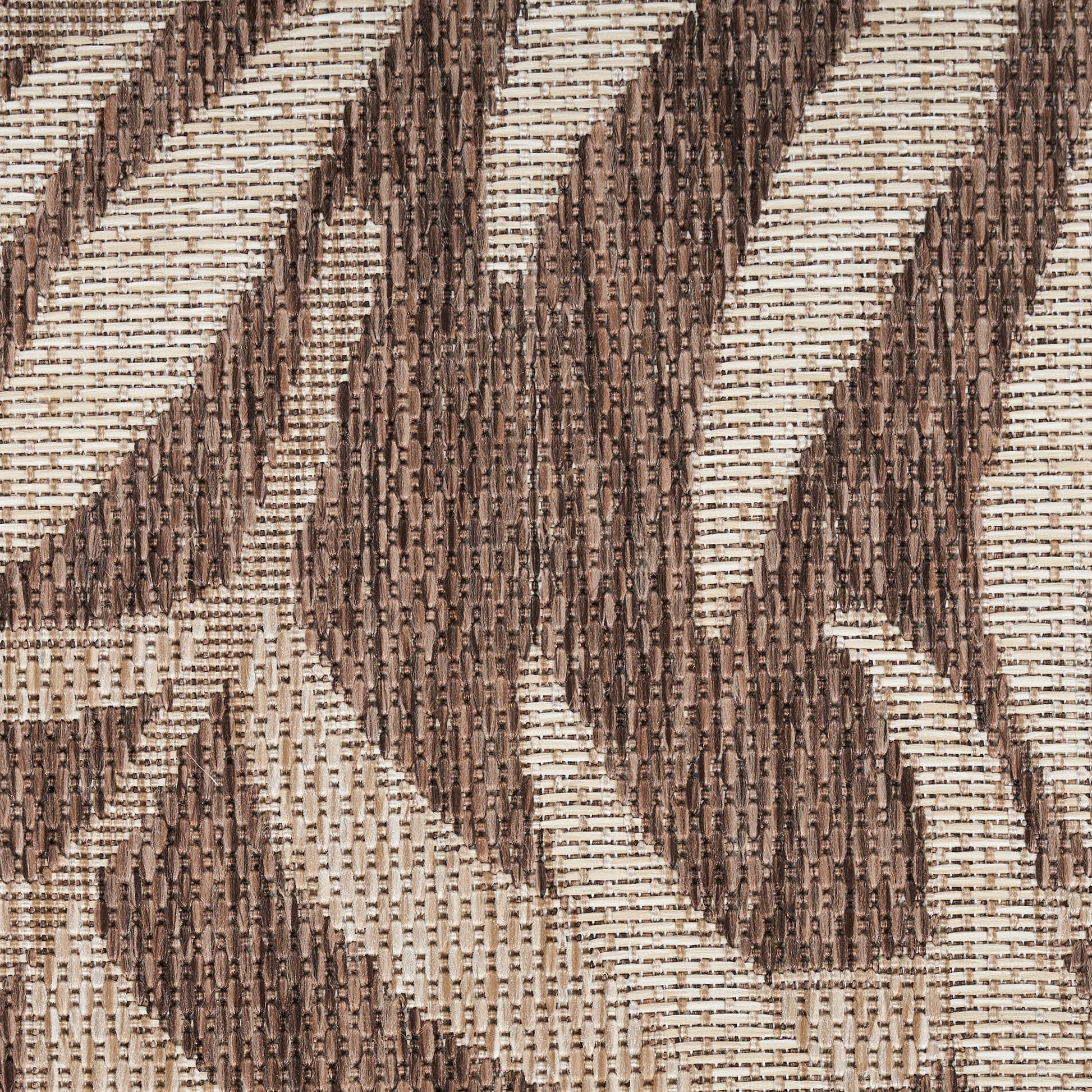 Brown and beige woven fabric with a bold geometric chevron pattern; textured, tweed-like textile for upholstery.